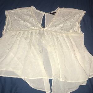 A white open backed blouse